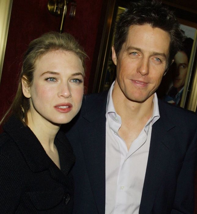 Renee Zellweger and Hugh Grant posing together at an event