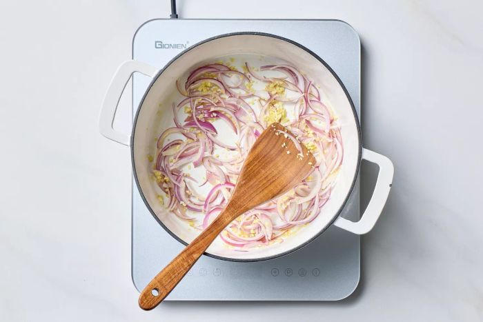 Onions and garlic sautéing on the stove