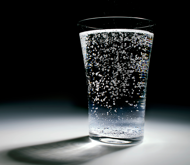 Glass of water lit by a spotlight