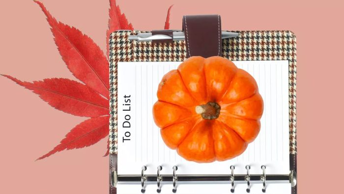 A checklist planner featuring autumn leaves and a pumpkin