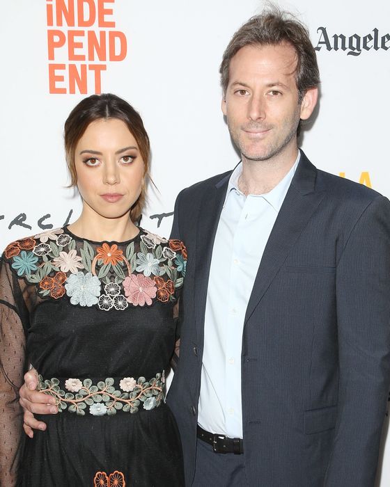 Jeff and Aubrey are seen together at a film festival, with Aubrey in a floral dress and Jeff in a suit.