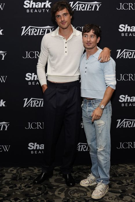 Jacob and Barry pose together at a Variety event; Jacob wears a collared shirt with trousers, while Barry opts for a casual sweater and ripped jeans. Barry reaches just below Jacob’s jawline.