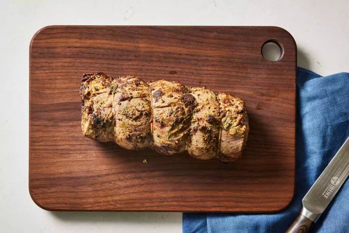 A perfectly cooked beef filet resting on a cutting board