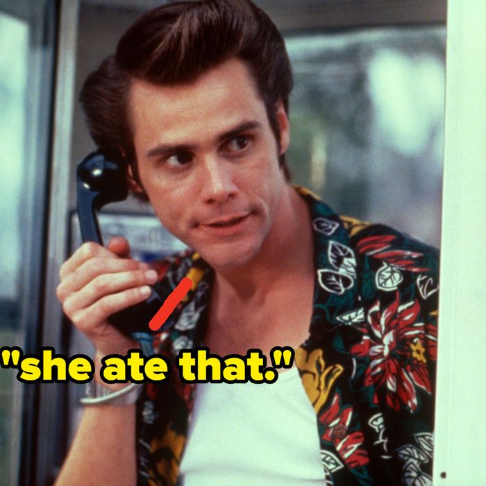 A person stands in a phone booth, dressed in a floral shirt, holding the phone with a serious expression.