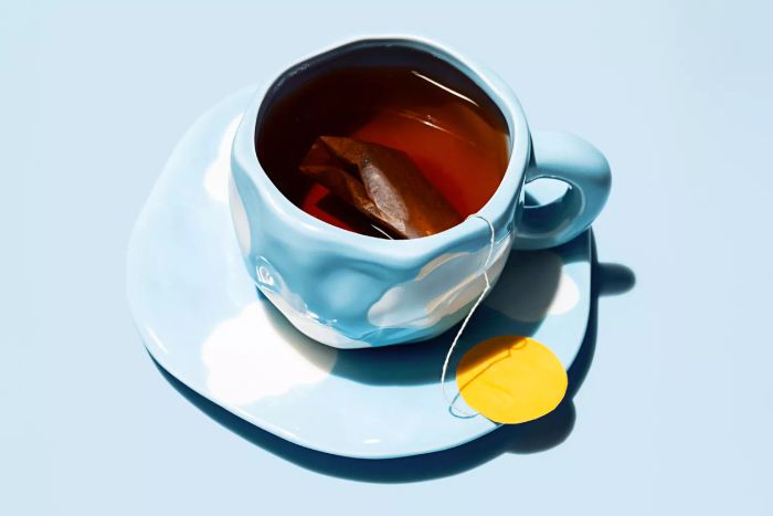A cup of tea with a teabag. Creative tea time concepts.