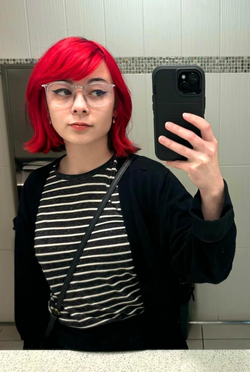 reviewer's vibrant red hair after using the dye