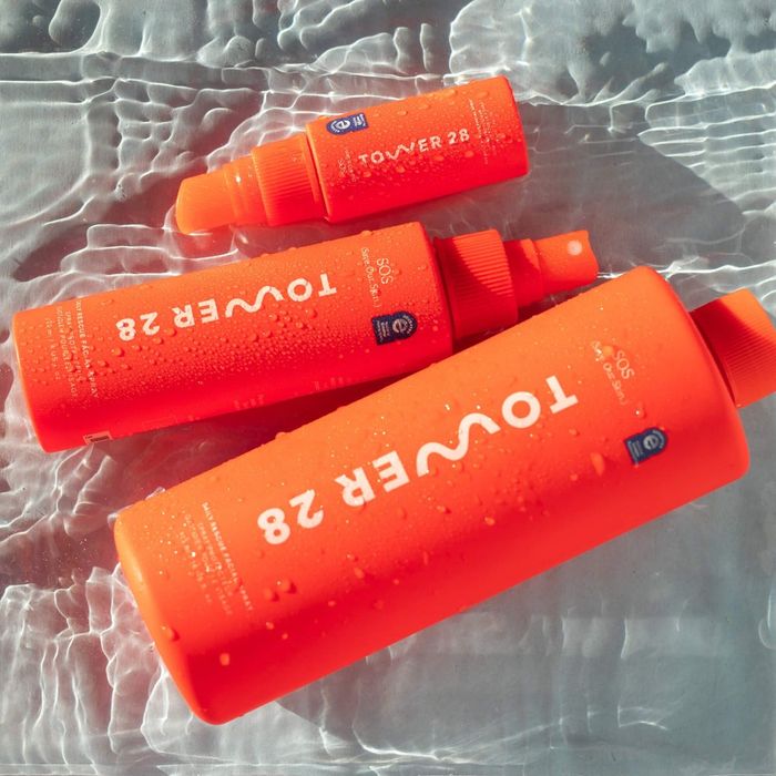 Three bottles of the spray floating in water