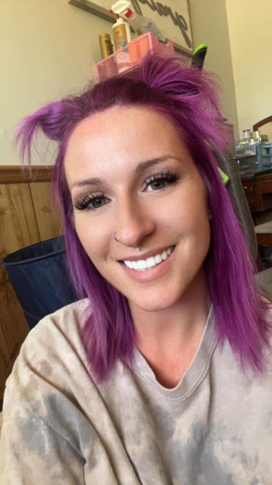 reviewer's stunning purple hair after dyeing
