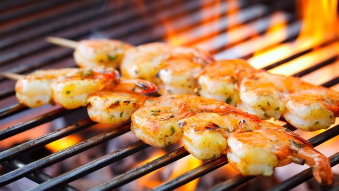 Lightly coat your shrimp with some mayo before grilling for a delicious result.
