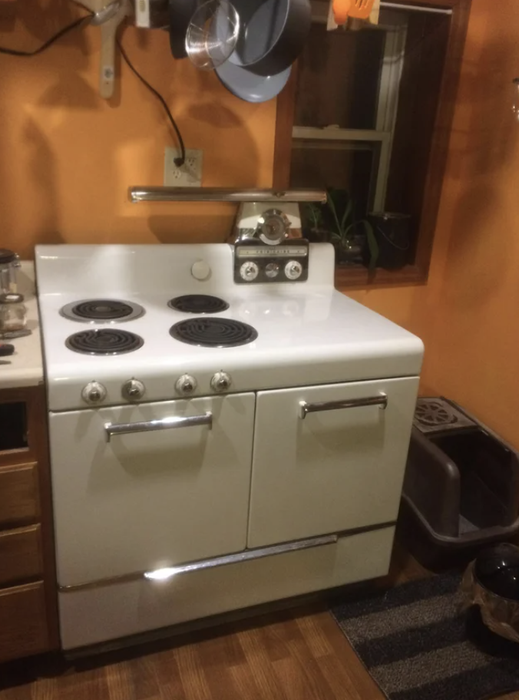 A sleek, compact stove with two doors and a built-in broiler.