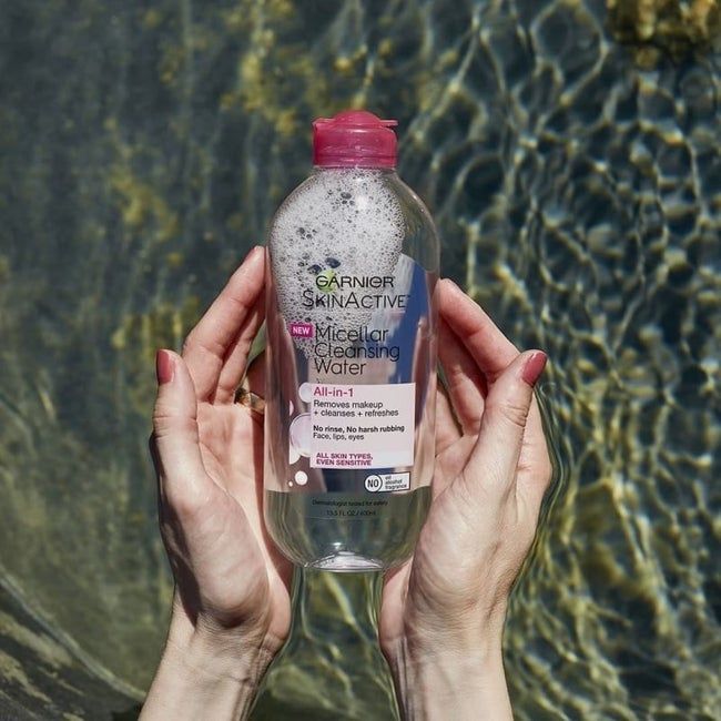 Hands holding the bottle