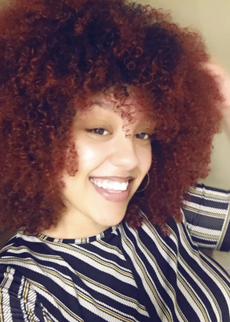 A photo of a curly-haired woman as reviewed by the customer.