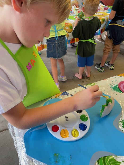 The author's son painting.