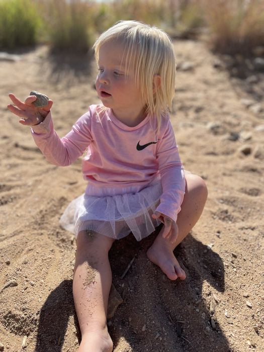 The author's daughter having fun in the sandbox