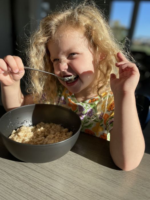 The author's daughter enjoying her bowl of oatmeal