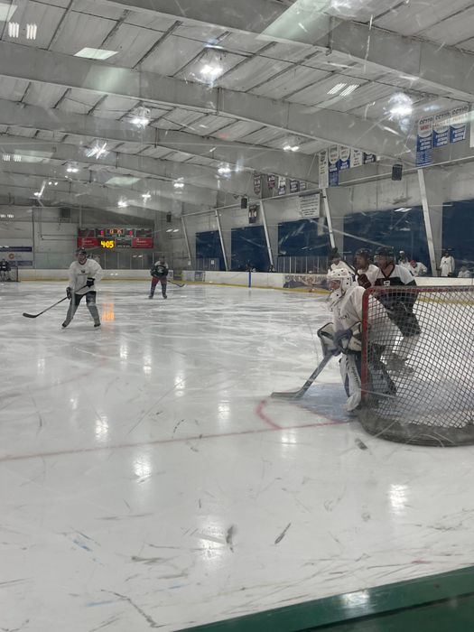 Hockey players skating on the ice.