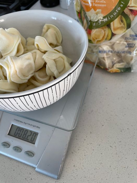 Tortellini weighed on the food scale.