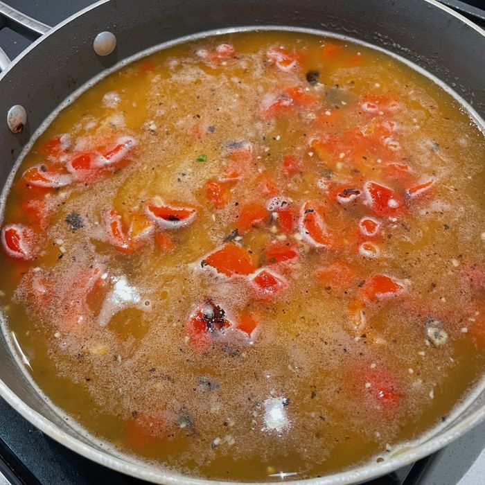 Orzo simmering on the stove.