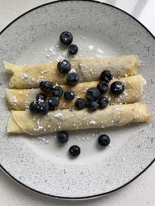Crepes served on a plate.