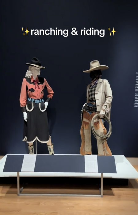 Two life-sized mannequins dressed in Western ranch attire: one in a dress with a hat, the other in a leather outfit with a lasso. The text reads: 