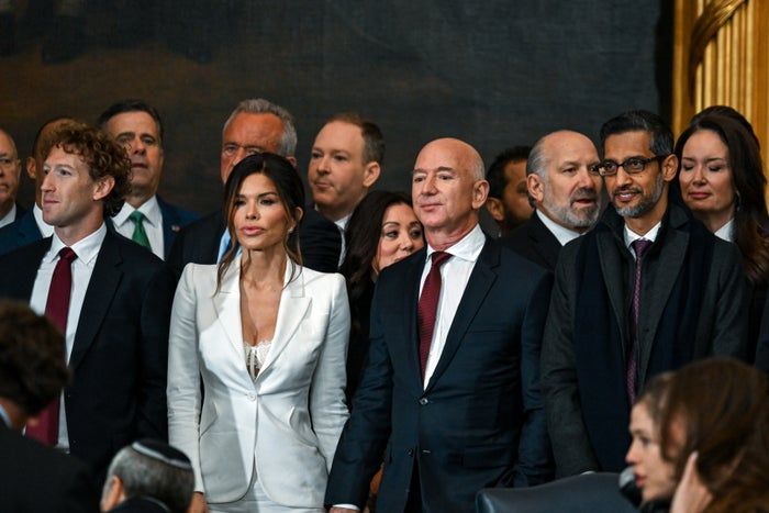 A group of business moguls and tech leaders, all dressed in formal attire, attended the public event.