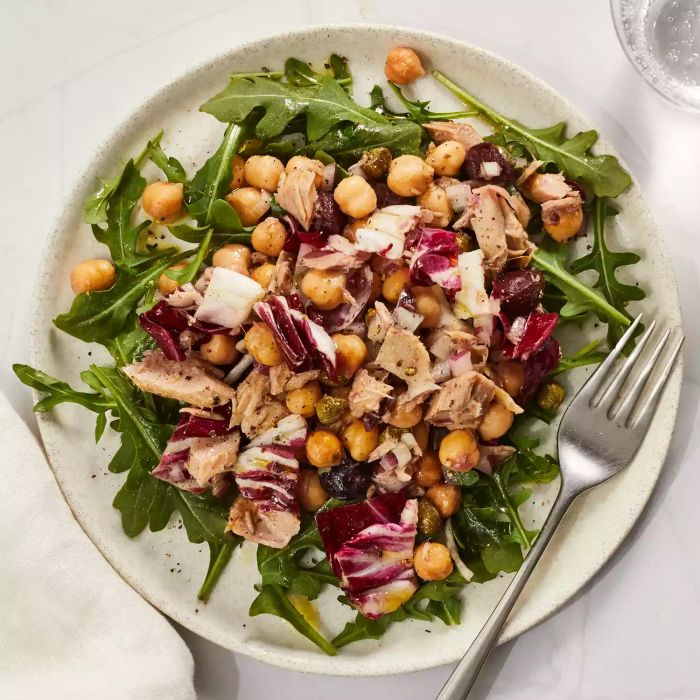 A plate of Chickpea-Tuna Salad served with fresh greens