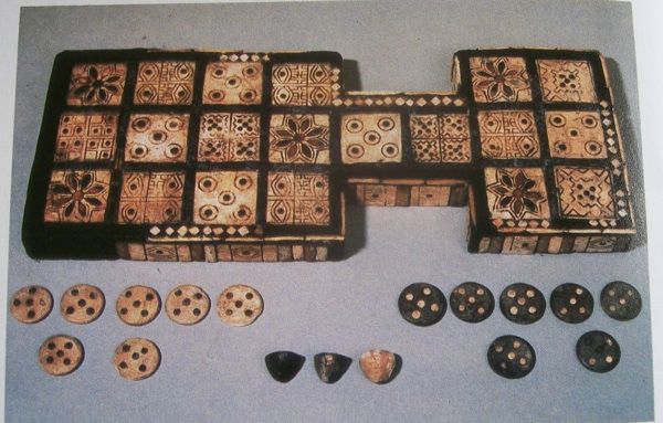 The Royal Game of Ur is the earliest known board game with surviving original rules. Discovered in Iraq during the 1920s, the oldest sets date back to approximately 2600 B.C. It is a race game, similar to Senet, where players roll dice to advance their pieces toward the goal.