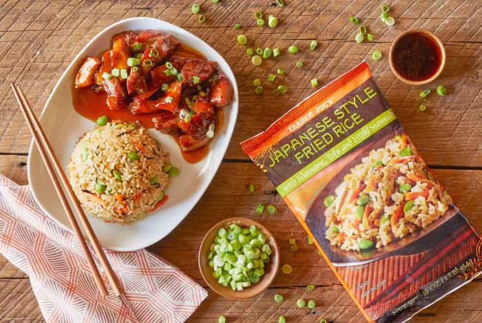 This Japanese-style fried rice from Trader Joe’s is a fan favorite among their frozen rice offerings. It’s made with all the essential ingredients—rice, peas, carrots, and soy sauce—but what sets it apart is the addition of edamame, fried tofu, and a hint of seaweed. These extra elements bring a unique texture and flavor, making it stand out from the chicken, pork, and vegetable variations.