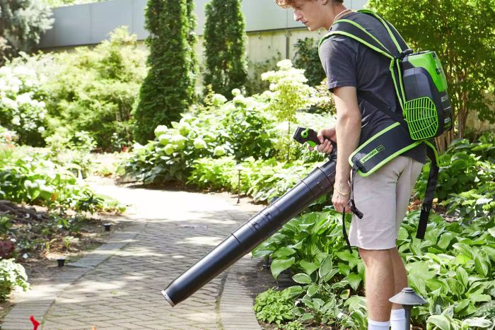 A person using the Greenworks Pro 80V Cordless Backpack Leaf Blower outdoors