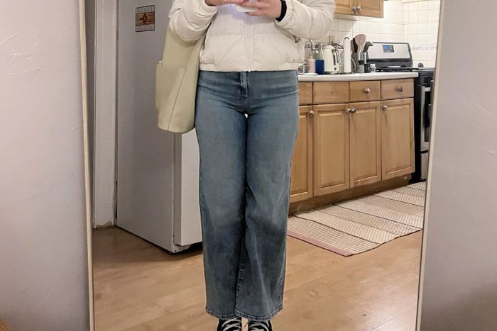 A person standing while wearing Joe's Jeans The Mia High-Rise Wide Leg Jean.
