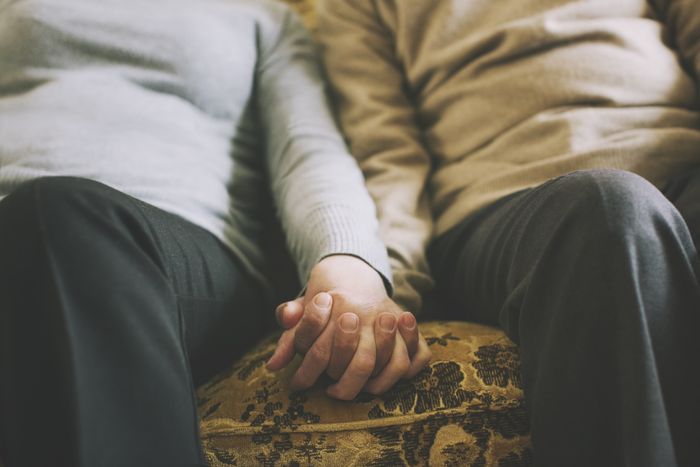 individuals joined together by holding hands