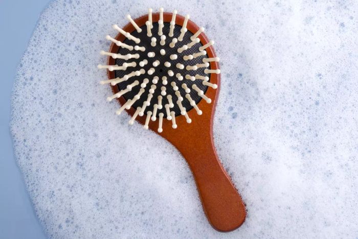 A wooden hairbrush with soap