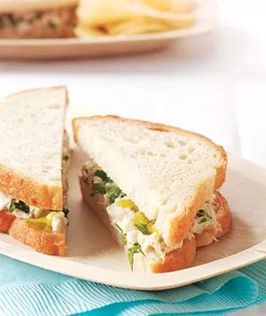 A classic pickled tuna salad sandwich served on a plate.