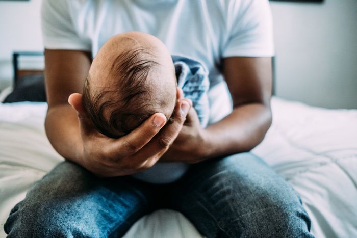A man holding a child in his arms.