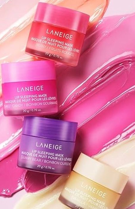 Various Laneige lip sleeping masks displayed on a shiny surface, perfect for skincare enthusiasts