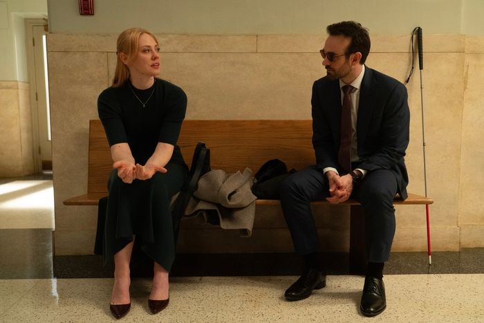 Deborah Ann Woll and Charlie Cox sharing a quiet moment on a bench together in a scene from 'Daredevil: Born Again'