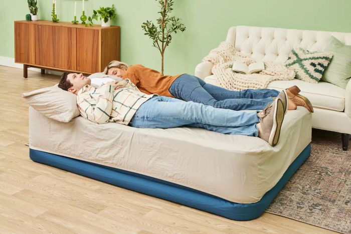 Two people relax on the Sealy AlwayzAire Flocked Top Air Mattress