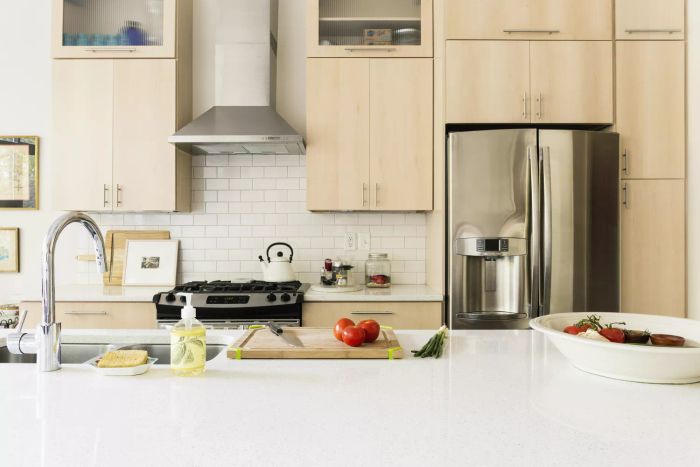 Kitchen counters adorned with food and cooking tools