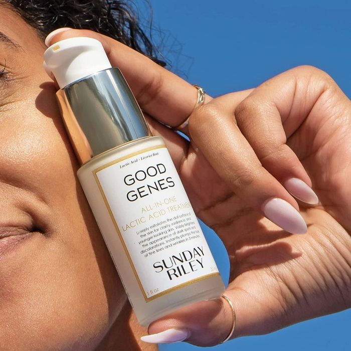 A model holding the lactic acid treatment close to their face