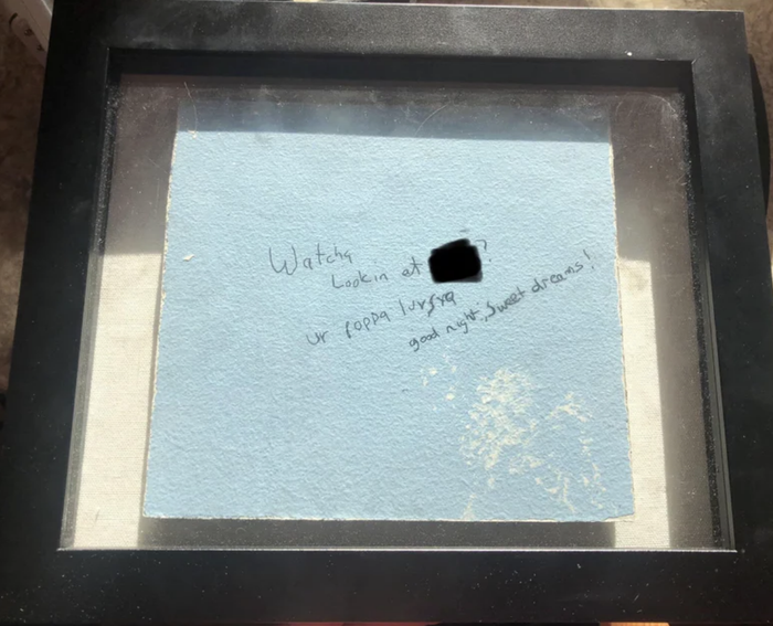 the framed portion of the wall with the note removed