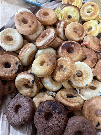 An assortment of freshly made mini donuts.