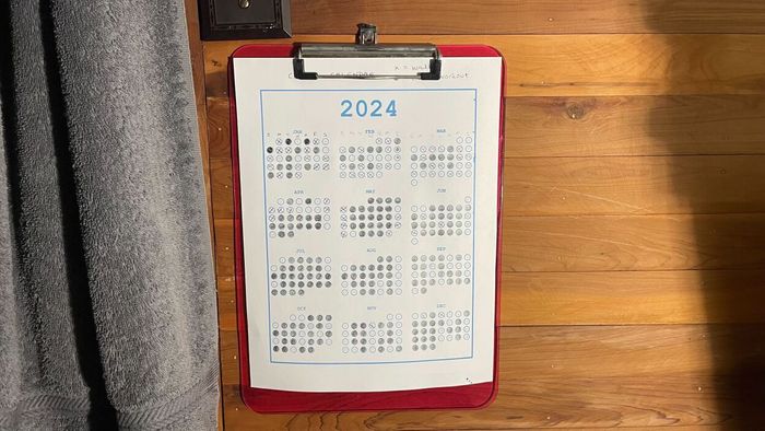 The bubble calendar, clipped to a board and mounted on my wall.