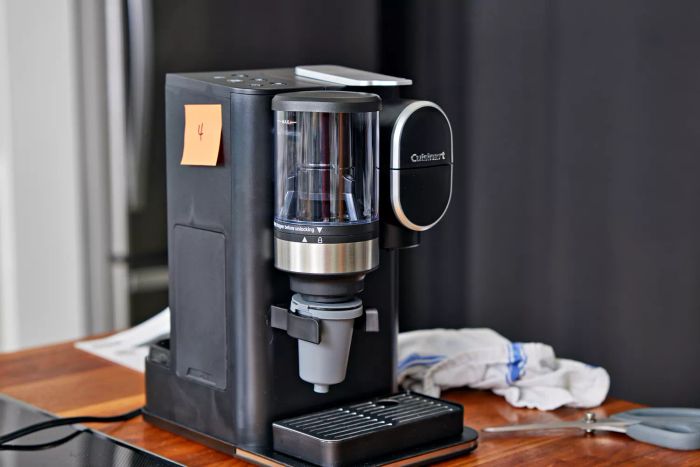 The Cuisinart Single-Serve Grind and Brew sits elegantly on a wooden countertop.