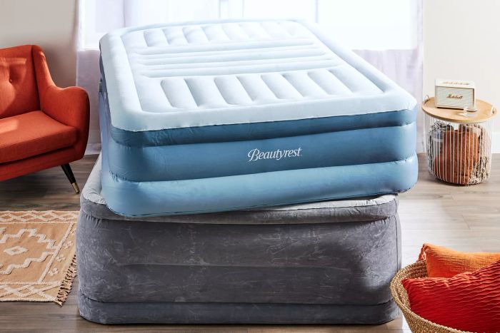 A stack of recommended air mattresses in a bedroom, ready for use.