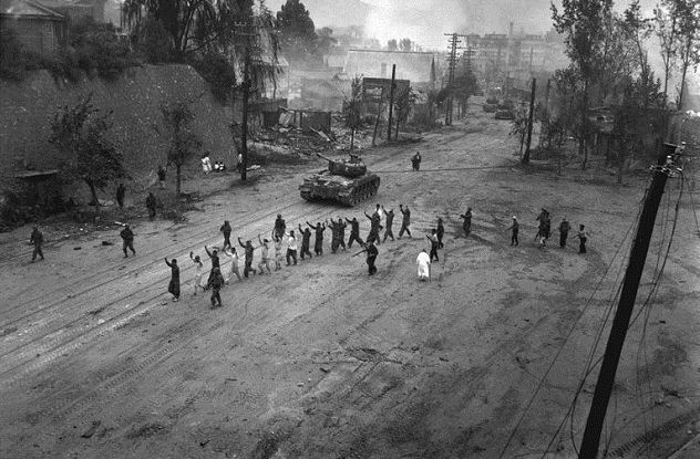766px-M26_Pershing_escorts_POWs_in_the_Korean_War