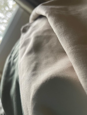A close-up shot of a white sheet displaying its fine microfiber texture.