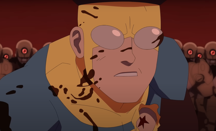 Mark from 'Invincible' in a tense close-up, with blood splattered on his superhero suit and face