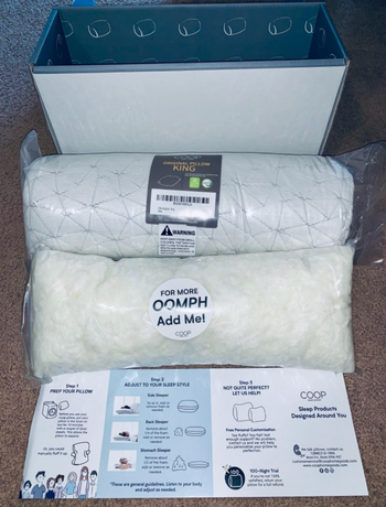 A package containing a rolled-up pillow and separate memory foam that can be added to the pillow.