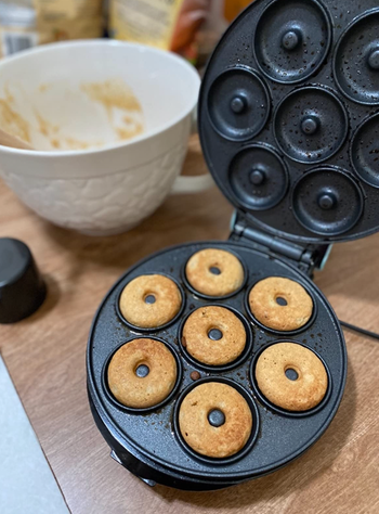 A donut maker with space for seven perfectly baked mini donuts.
