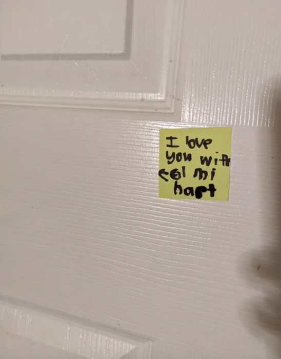 a post-it stuck on a door